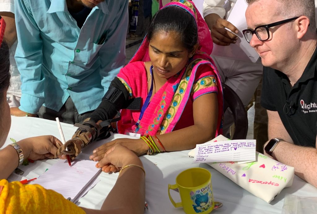 Give a Hand Recipient (L), David Meade, founder of Lightbulb Teams (R). India, 2019
